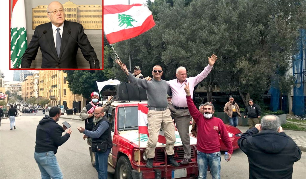 العسكريون وسط بيروت استعداداً لمنع وصول الوزراء الى السراي (وبدا الرئيس ميقاتي داخل الاطار يعلن التأجيل الجلسة) (محمود يوسف)